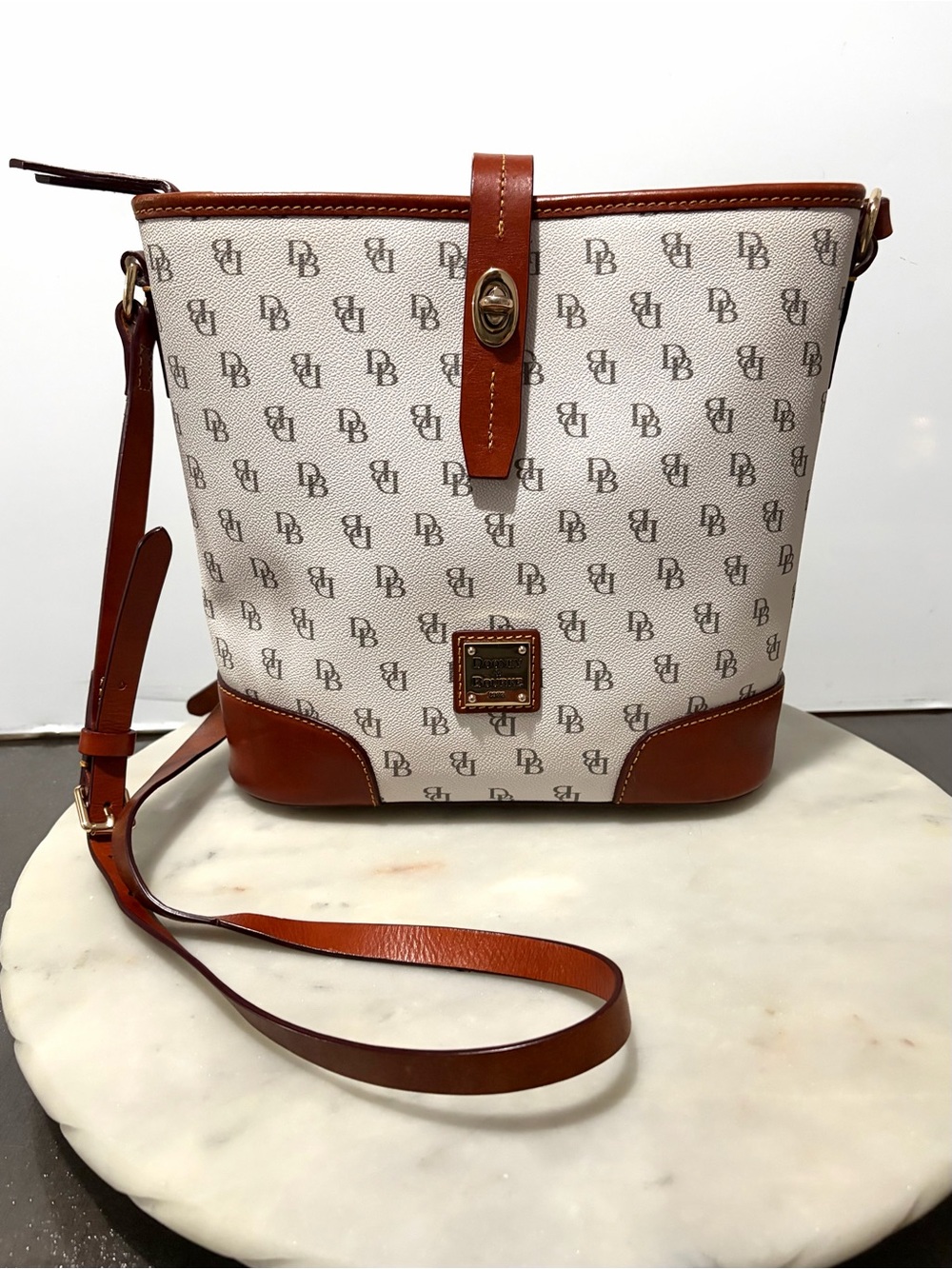 Dooney & Bourke Logo Gretta Turnlock Bucket Crossbody Bag White Brown Leather